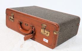 An excellent 1950's gentlemans suitcase of leather and ostrich construction with original makers