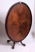 A Victorian mahogany and ebony banded loo table / tilt top dining table.