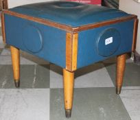 A vintage early 20th century blue vinyl and beech wood foot rest of unusual shape together with an