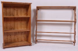 A good sized antique style country pine wall rack with multiple shelves and shaped supports