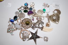 A large collection of vintage and 20th century silver and white metal pendants some set with