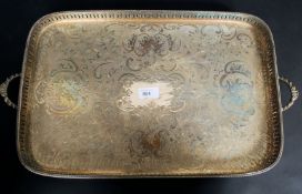 A large silver plated rectangular butlers / serving tray with pierced gallery sides and chased