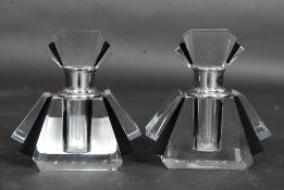 A pair of art deco style fan shaped perfume bottles