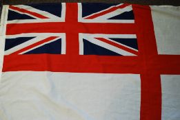 A British Naval Ensign flag having white background,