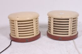A pair of vintage 1950's Art Deco HMV heaters in the manner of Christian Bauman.
