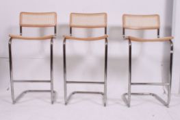 A set of 3 1980's retro caned cantilever Italian bar stools.