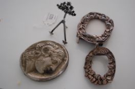 Two silver scenes picture frames of rococo form  together with an 800 silver easel with floral