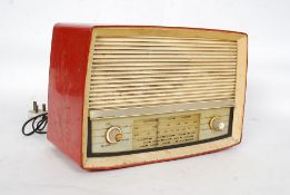 A vintage two tone red and cream Ecko radio