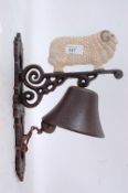 A 20th century cast iron wall hanging bell and bracket,