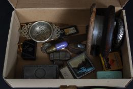 An interesting box of curios to include silver hallmarked thimbles, vintage fly fishing reel,