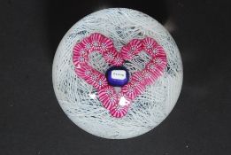 A Perthshire limited edition paperweight having spiral form with millefiori heart with inscription