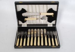 A mid century cutlery canteen with inset fish knife and fork in original case