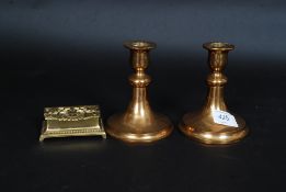 A pair of heavy Scandinavian Malm candlesticks along with a vintage brass art nouveau stamp case