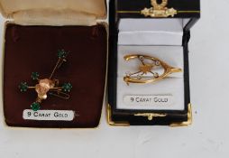 Two 9ct gold / yellow metal (both stamped ' 9ct gold ' ) Australia shaped brooches.