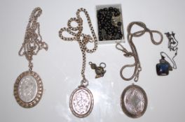 A collection of 3 good Victorian and later large silver lockets having chase decorated rococo