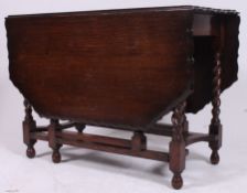 A good quality Jacobean revival barley twist large drop leaf dining table having gadrooned edge
