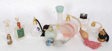 A collection of vintage and retro perfume atomizers and perfume bottles some with contents