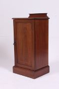 A Victorian mahogany inlaid pot cupboard, with a raised gallery back and two shelves within.