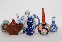 A collection of Chinese ceramic wares to include a moon flask,