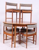 A retro 1960's Mcintosh of Kirkcaldy teak dining suite comprising a circular extending dining table
