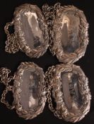 A set of four silver plated decanter labels for Gin, Brandy,