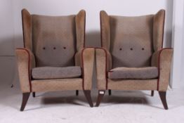 A pair of 1950's vintage retro wing back armchairs.