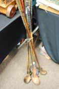 A collection of vintage hickory shaft golf clubs together with others