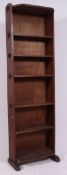 An early 20th century Arts & Crafts revival tall oak peg jointed bookcase cabinet,