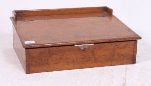 A vintage 1930's clerks table top desk having hinged top with recess beneath