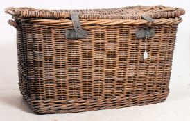 An early 20th century large whicker basket having cast metal thick clasp to front with hinged top -