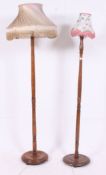 A near pair of 1930's oak Art Deco standard lamps,