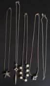 A collection of silver necklaces to include star pendant on chain, lozenge tear drop pendant,