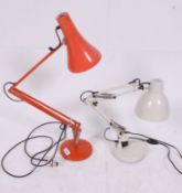 A vintage Herbert Terry anglepoise industrial desk lamp in orange Raised on circular base with
