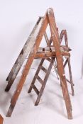 A collection of 20th century Industrial Three vintage wooden step ladders