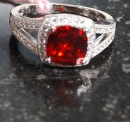 A 925 white metal silver CZ and simulated ruby ring