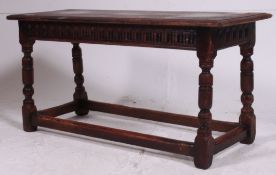 An early 20th century Jacobean revival peg jointed ipswitch oak foot stool.