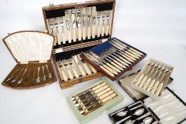 A Darby oak cased canteen of cutlery together with a collection of cased silver plated flatwares in