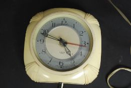 A 1930's Art Deco electric cream bakelite wall clock by Smiths - Sectric,