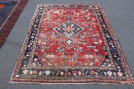 A good quality handmade Turkish / Persian rug having central medallion design with red and blue