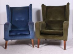 A pair of mid 20th century retro vintage armchairs raised on beech turned tapered legs ,