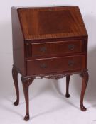 A Regency style flame mahogany ladies writing bureau.