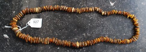 A good assorted amber bead necklace. Single row, with various amber beads and similar.