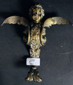 A large brass winged cherub ormulu table / clock mount with rococo scrollwork and screw mount holes