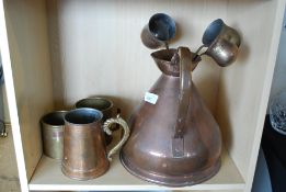 A collection of vintage copper jugs and measures dating to the early 20th century / 19th century (