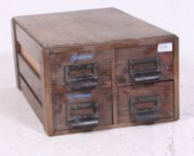 A vintage 1950's Industrial wooden 4 drawer table top filing cabinet index.