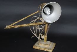 An Original 1940's Herbert Terry lamp retaining the original mottled paintwork in part.