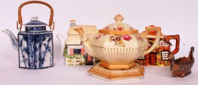 A collection of four tea pots to include Johnson Ltd Burslem with its stand,