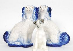 A pair of 20th century ceramic Spaniels in unusual colours being unsigned to the base together with