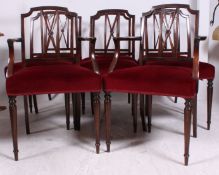 A set of 8 Edwardian mahogany dining chairs having padded seats with turned legs and pierced back