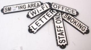 A collection of 6x cast iron wall plaque signs - each with specific notation - Wi Fi, Toilet,